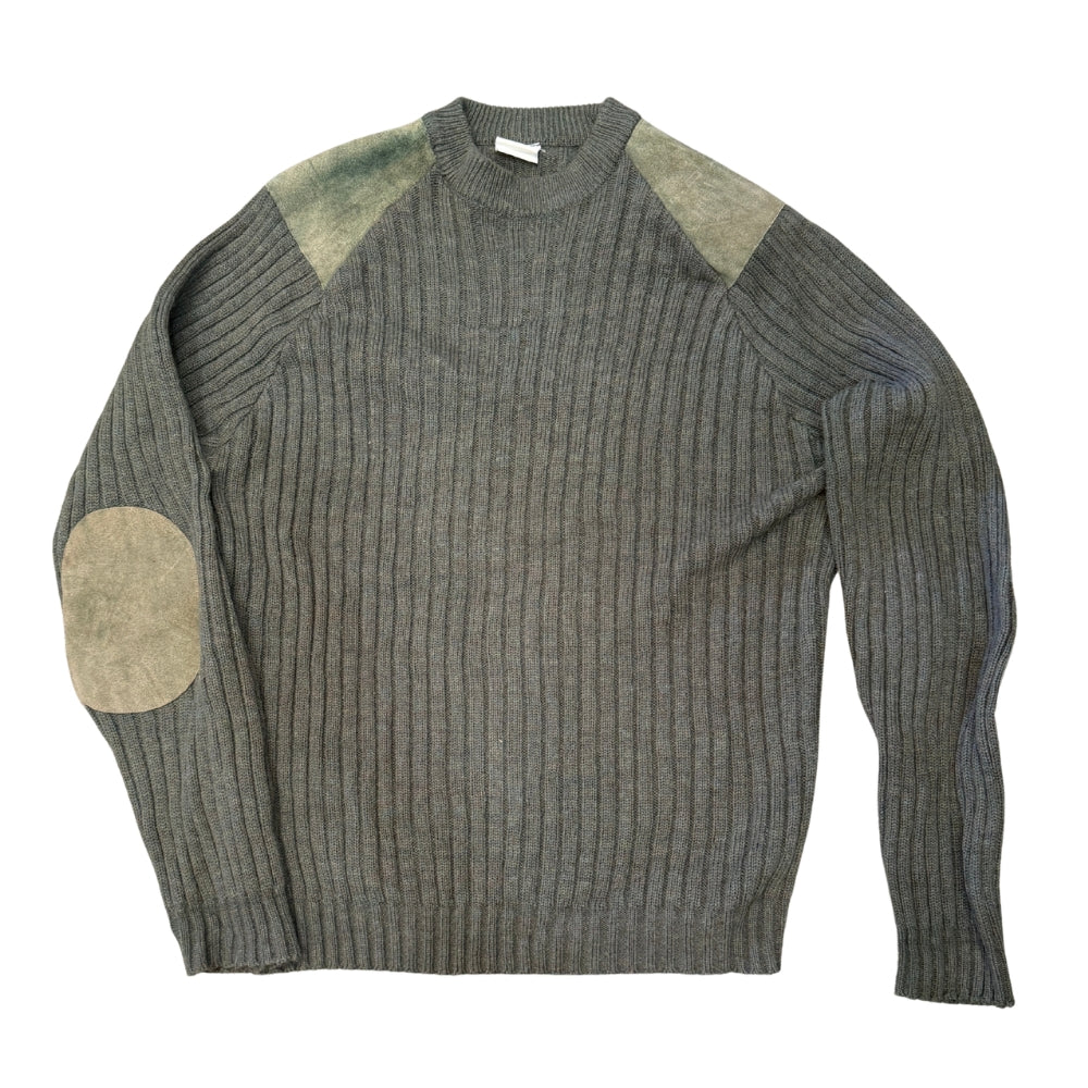 A ribbed knit sweater in dark gray with contrasting light beige shoulder panels and elbow patches, shown flat against a white background.